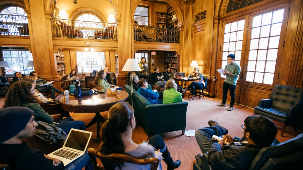 Students attend a poetry reading.